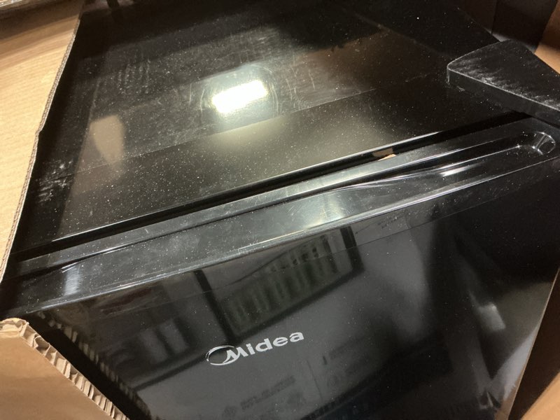 Condition photo showing As Is for midea whs-65lb1 compact single reversible door refrigerator, 1.6 cubic feet(0.045 cubic meter), black black 1.6 cubic feet