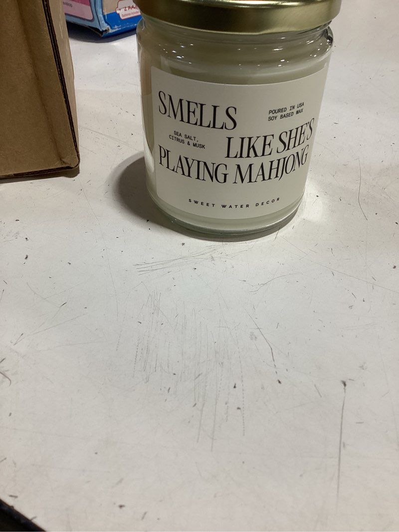 Condition photo showing As Is for sweet water decor smells like she’s playing mahjong candle, funny mahjong gift for women, 9oz candle with gold lid, sea salt citrus musk amber scent, non-toxic soy wax, unique game night gift idea smells like she's playing mahjong