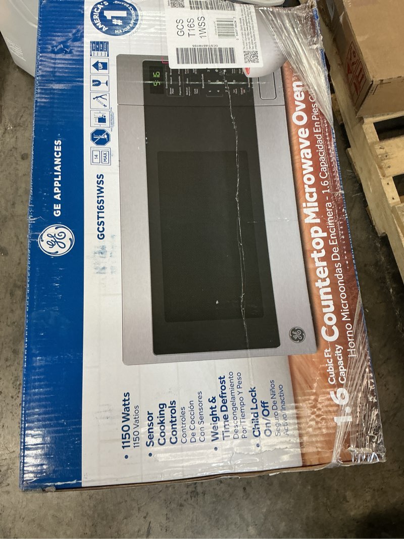 Condition photo showing Good Condition for ge 1.6 cu. ft. countertop microwave oven