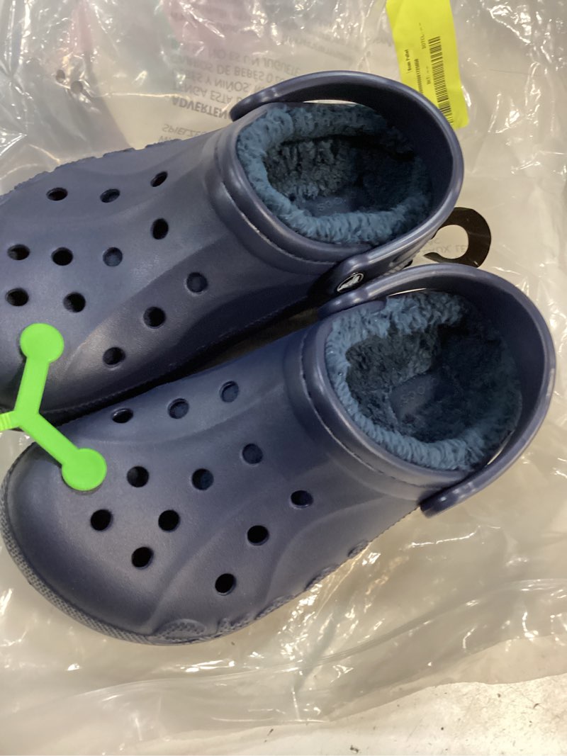 Condition photo showing New/Like New for size women’s 7/mens 5 crocs unisex-adult baya lined clog