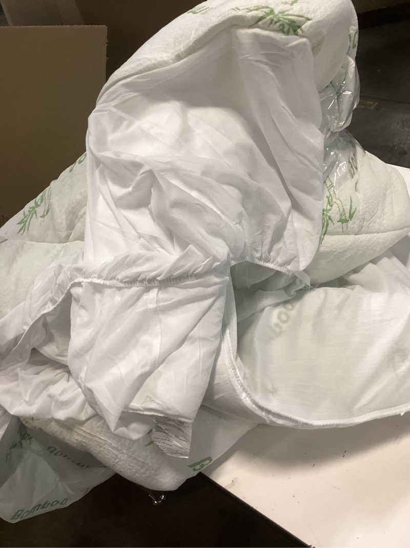 Condition photo showing As Is for Bamboo Mattress Protector -Breathable Cooling Cover Protects Against Moisture, Spills, Stains - Noiseless, Machine Washable, (unknown size)60*80 inc 