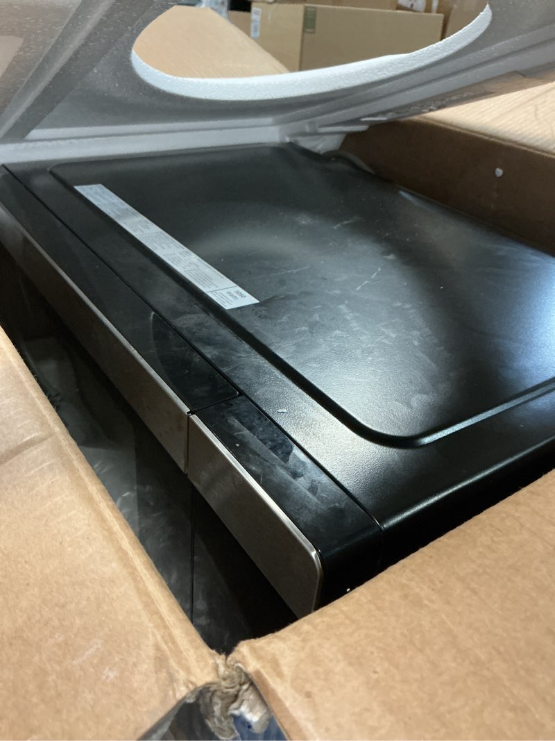 Condition photo showing As Is for GE GCST10A1WSS 4-in-1 Microwave Oven, 1,050 Watts Air Fryer, Broiler & Convection Mode, Child-Lock Technology, Kitchen Essentials for The Countertop or Dorm Room, 1.0 Cu. Ft, Stainless Steel