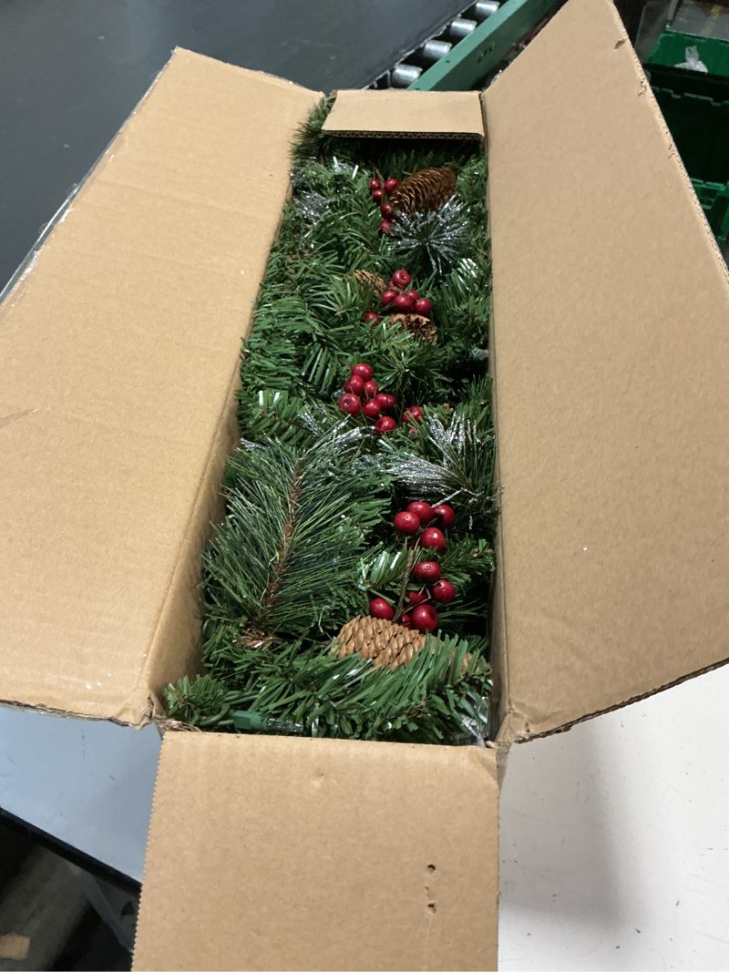 Condition photo showing Good Condition for national tree company 9 ft pre-lit crestwood spruce artificial christmas garland, christmas decoration with glitter, pinecones, red berries, 50 clear lights, 180 tips, green plug in tree