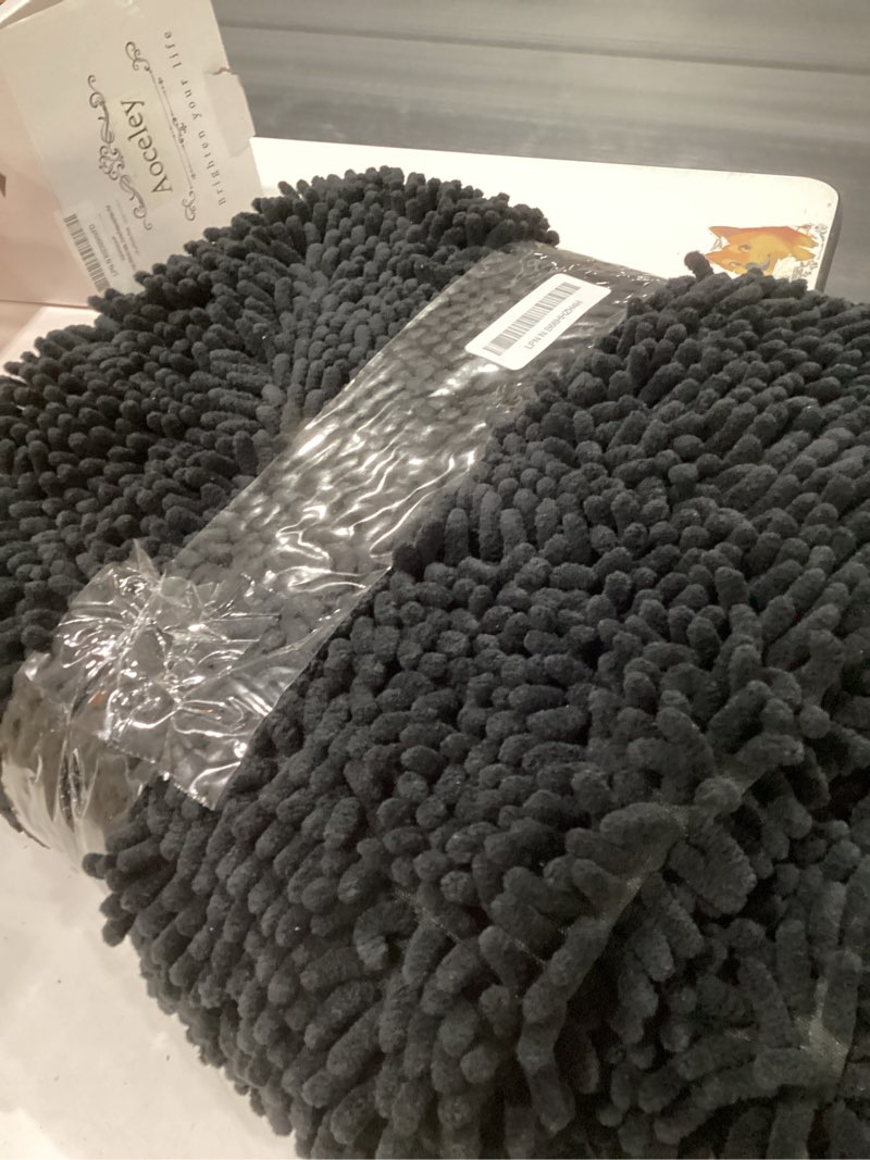 Condition photo showing New/Like New for OLANLY Dog Door Mat for Muddy Paws 48x30, Absorbs Moisture and Dirt, Absorbent Non-Slip Washable Doormat, Quick Dry Chenille Mud Mat for Dogs, Entry Indoor Entryway Carpet for Inside Floor, Black Black Solid 48" x 30"