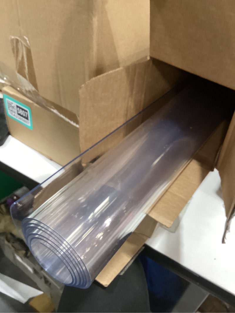 Condition photo showing As Is for Clear Table Cover Protector 24 x 48 Inch, 2mm Thick Clear Desk Mat, Plastic Table Cover, Transparent Desk Cover, Desk Protector Mat for Desktop, Writing Desk Clear 2mm 24" x 48"