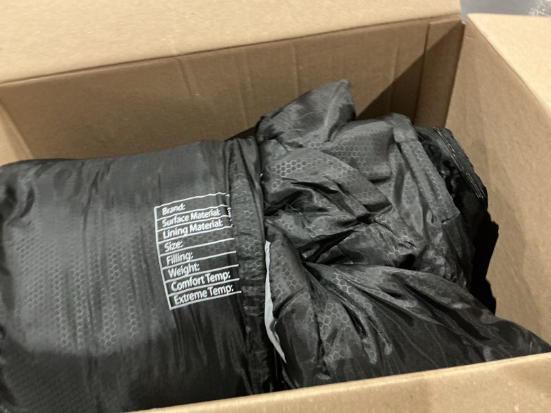 Condition photo showing As Is for item is used black and grey sleeping bag with a waterproof bag 