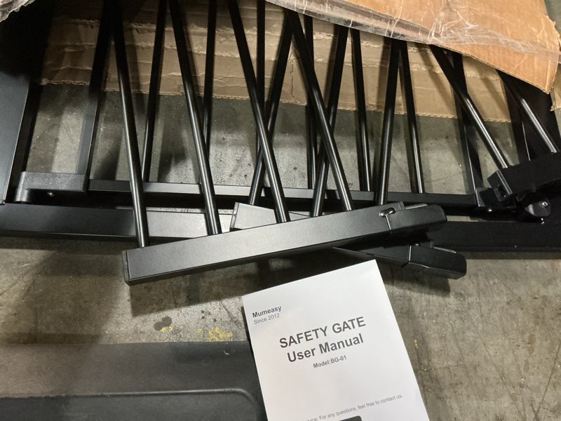 Condition photo showing As Is for mumeasy baby gate extra wide, 29.5-51'' pressure mounted dog gate with walk thru door, auto close pet gate for house, stairs, doorways,black