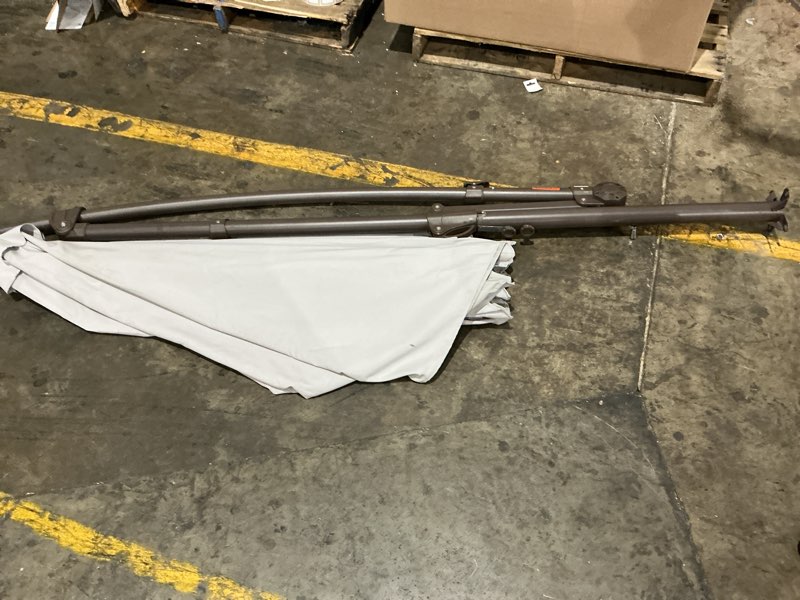 Condition photo showing As Is for incomplete. missing parts. outdoor offset cantilever umbrella patio umbrella in light gray