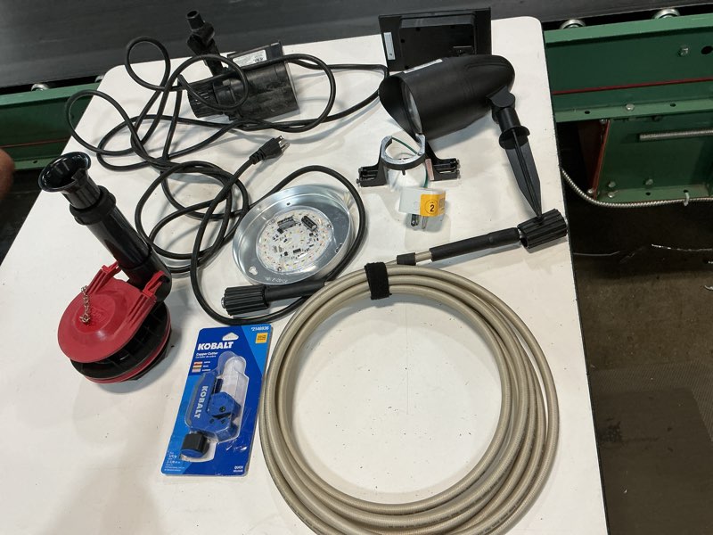 Condition photo showing As Is for assorted home improvement lot (small tools, screw, home accessories, etc.)