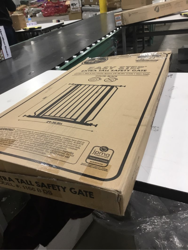 Condition photo showing As Is for Regalo Easy Step Extra Tall Walk Thru Baby Gate, Bonus Kit, Includes 4-Inch Extension Kit, 4 Pack of Pressure Mount Kit and 4 Pack of Wall Cups and Mounting Kit, Black Black 29-36.5"W x 36"H