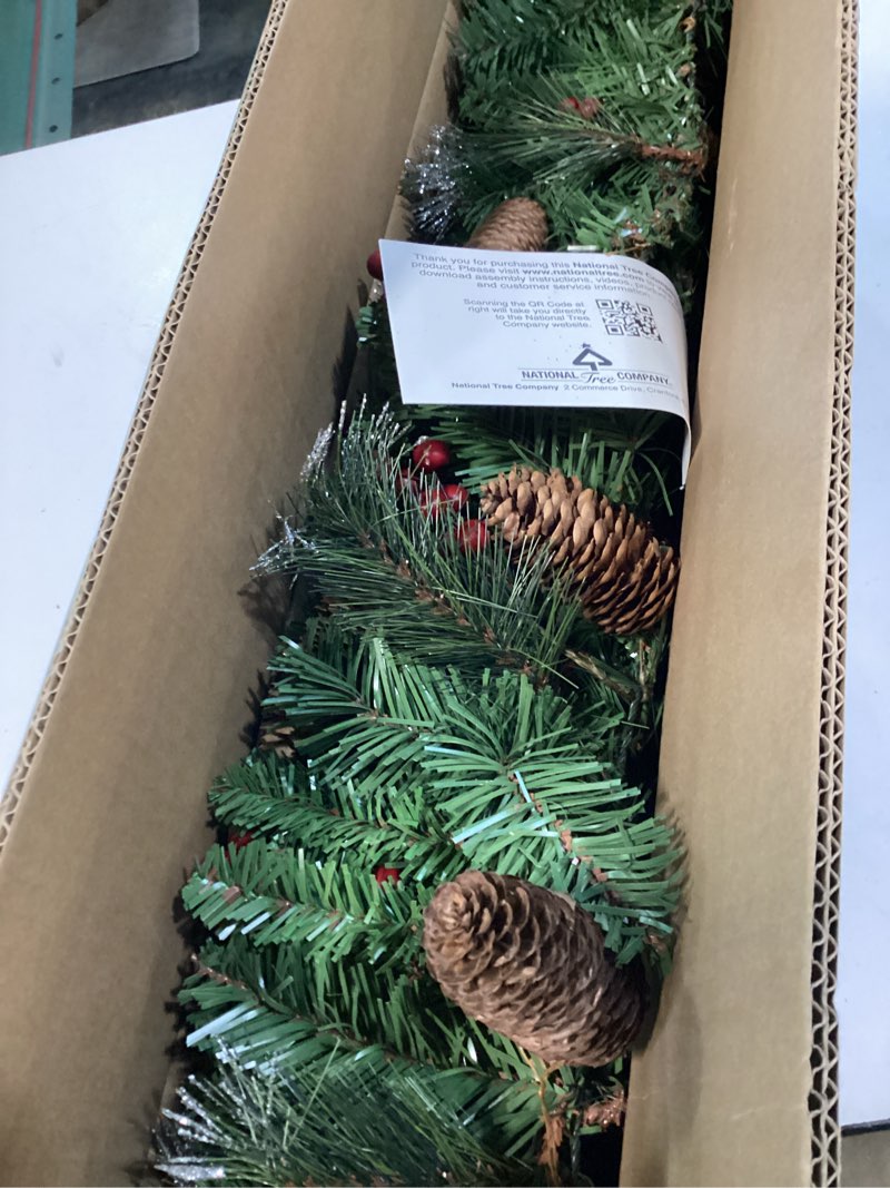 Condition photo showing Good Condition for national tree company 9 ft pre-lit crestwood spruce artificial christmas garland, christmas decoration with glitter, pinecones, red berries, 50 warm white led lights, 180 tips, timer, green battery operated tree
