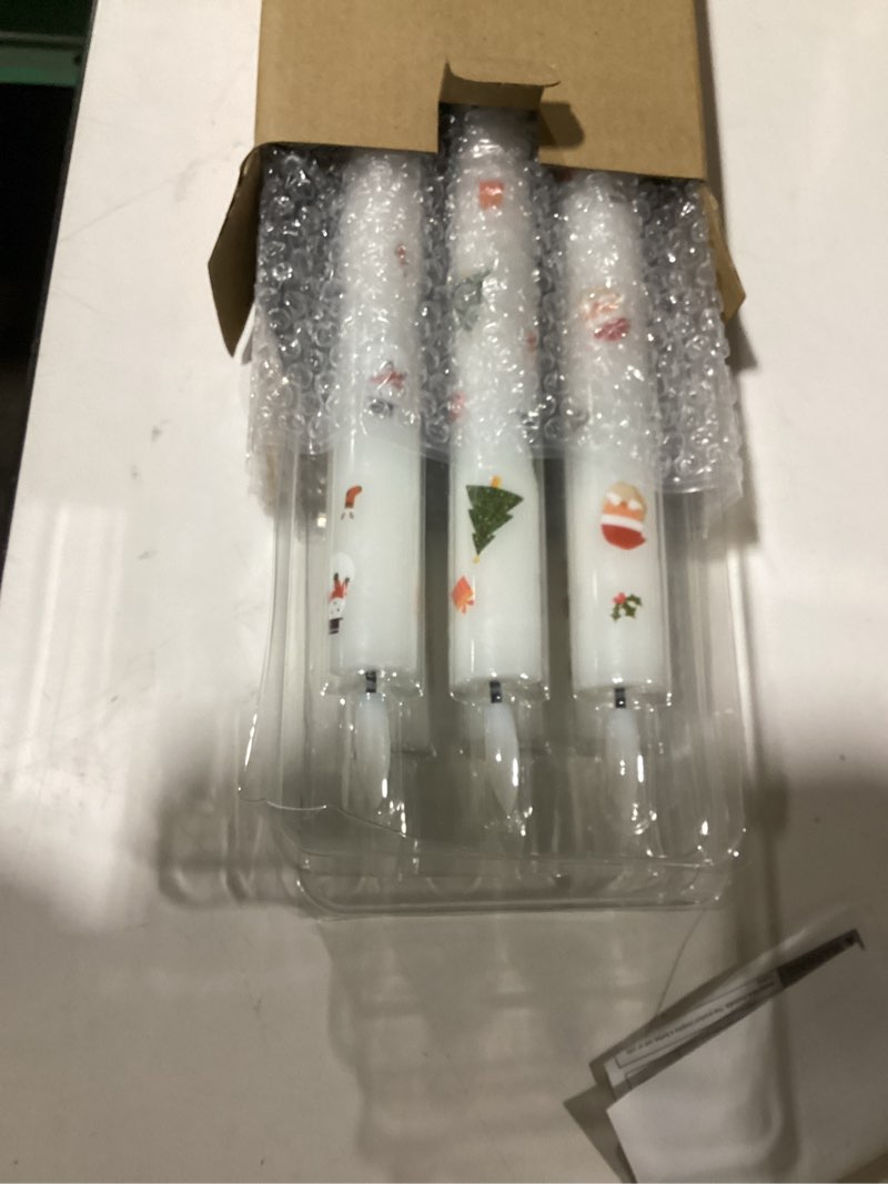 Condition photo showing Good Condition for Eldnacele Christmas Taper Flameless Candle Remote and Timer, Battery Operated 3D Wick Flickering Christmas Tree,Santa,Snowman Decal Candles Real Wax LED Candles Dinner Holiday Decor(6Pcs,0.78"×9.6" 3-White Taper Candles