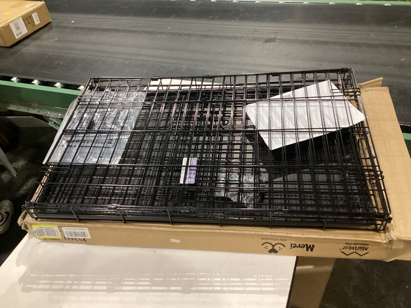 Condition photo showing Good Condition for midwest homes for pets 36-inch icrate for medium-large breeds, 41-70 lbs, single door folding dog crate with divider panel, leak-proof tray & secure latches, portable, durable & easy to assemble black - single door intermediate (36"l)