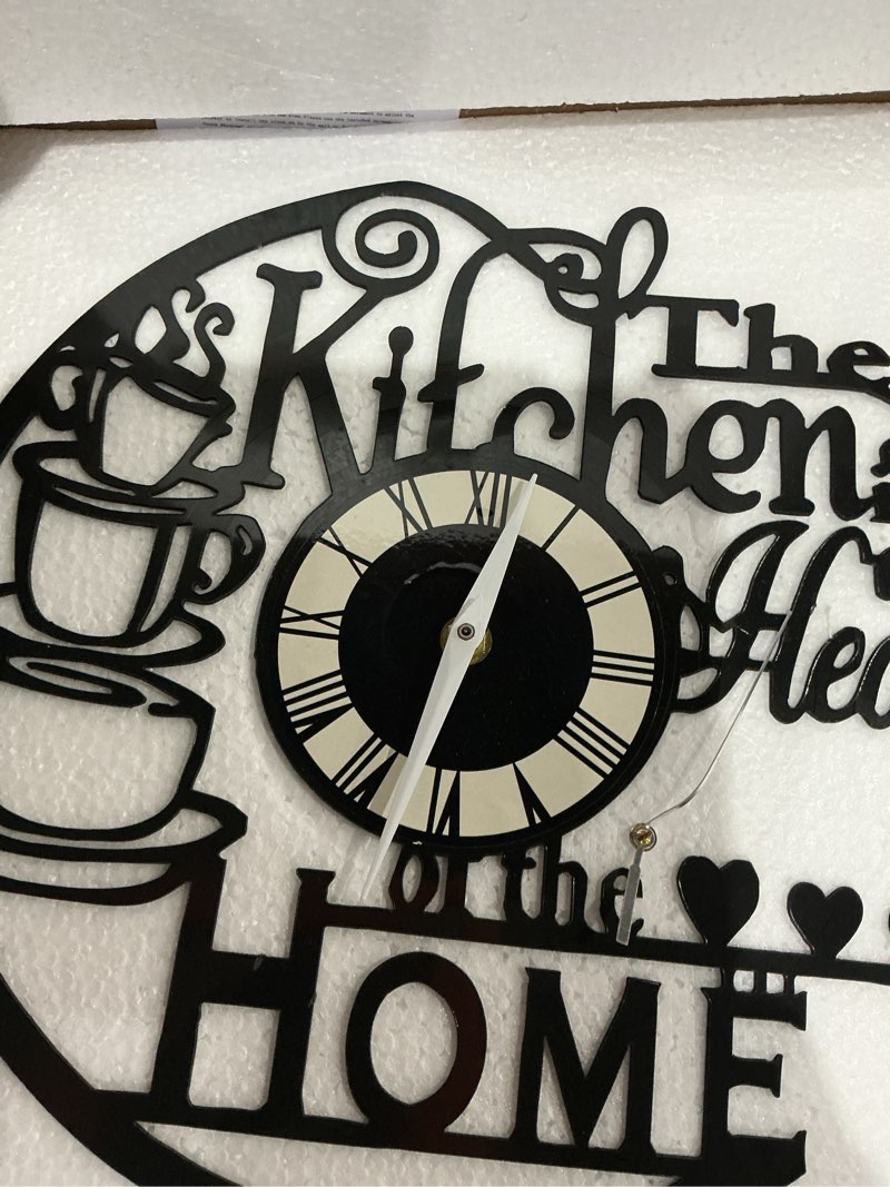 Condition photo showing As Is for kitchen wall clock with cup design, the heart of the home, 12 inches