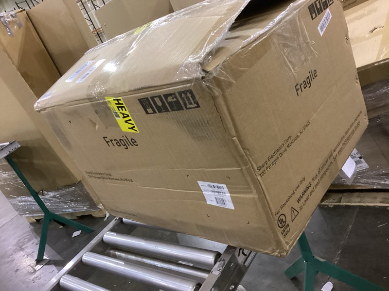 Condition photo showing As Is for SHARP Countertop Microwave Oven with Removable 12.4" Carousel Turntable, 1000 Watt, 1.1 Cubic Feet, 