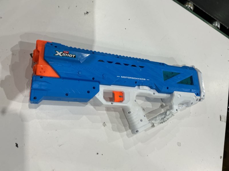Condition photo showing As Is for xshot water mega pulse motor soaker (fast fill) motorized outdoor water blaster by zuru for ages 8+
