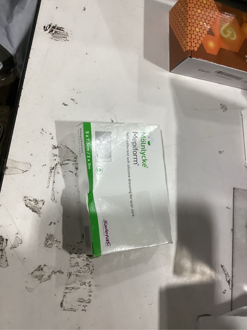Condition photo showing As Is for mepiform self-adherent silicone dressing 2" x 3" 2" x 3" sterile