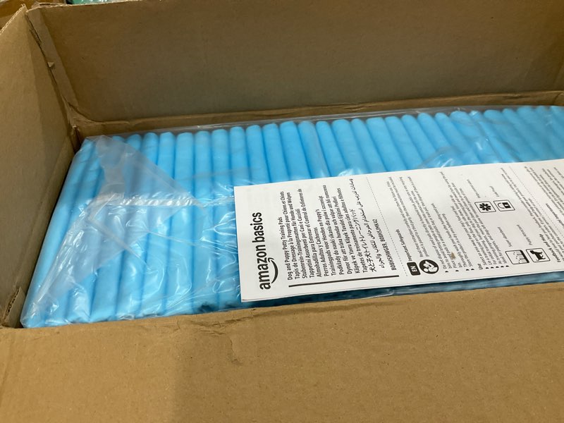 Condition photo showing New/Like New for Amazon Basics Absorbent Dog and Puppy Pee Pads with 5-Layer Leak-Proof Design and Quick-Dry Surface for Potty Training, Heavy Duty Absorbency, Giant, 27.5 x 44 Inch - Pack of 30, Blue & White