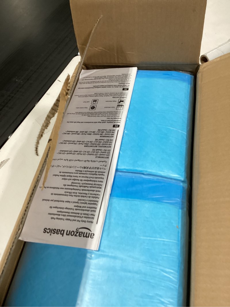 Condition photo showing New/Like New for Amazon Basics Heavy Duty Dog and Puppy Pee Pads, 5-Layer Leak-Proof Ultra Absorbent, Quick-Dry Surface, Potty Training, Regular (24x23"), 80 Count, Blue & White 24 x 23 Inches 80.0