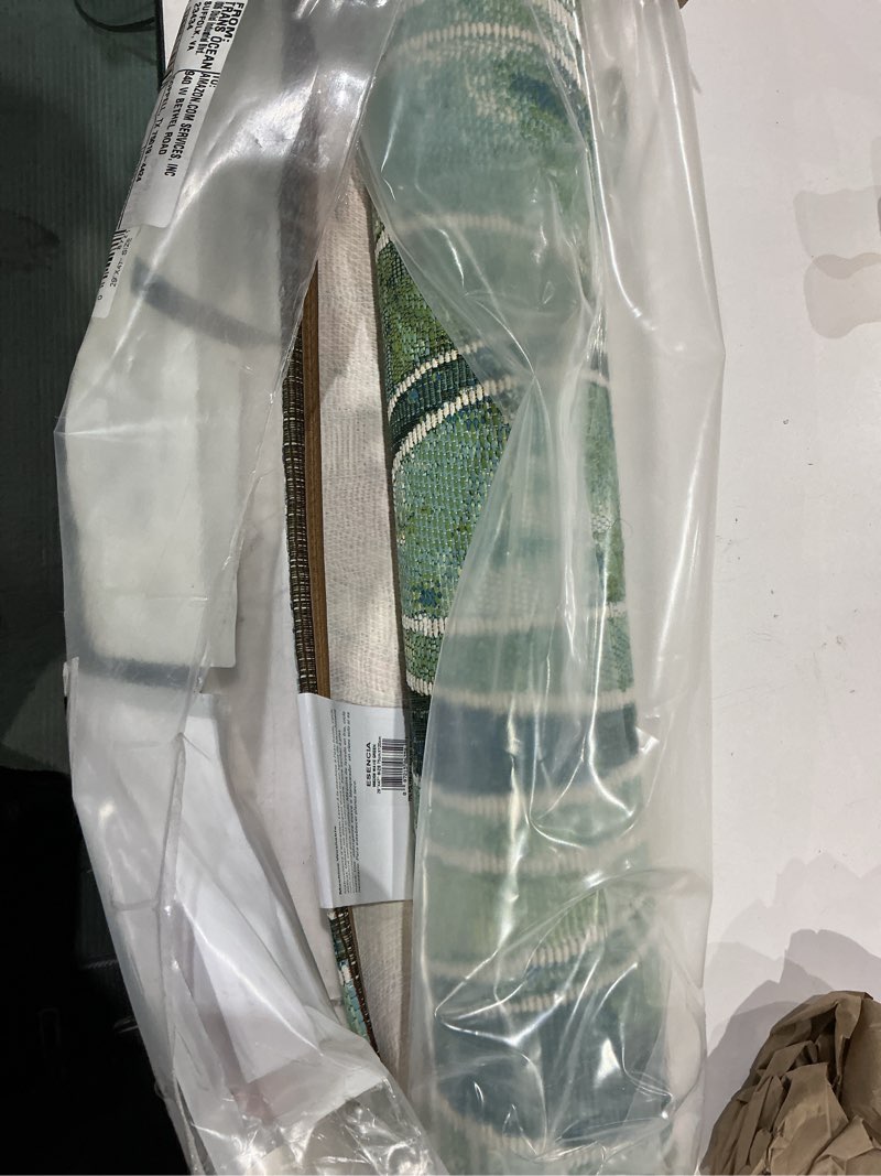 Condition photo showing New/Like New for liora manne esencia indoor/outdoor power loomed latex back non slip mat - contemporary stripe casual ocean colorful (wave green) (2'5" x 3'11") 2'4" x 3'11" (rectangular) wave green