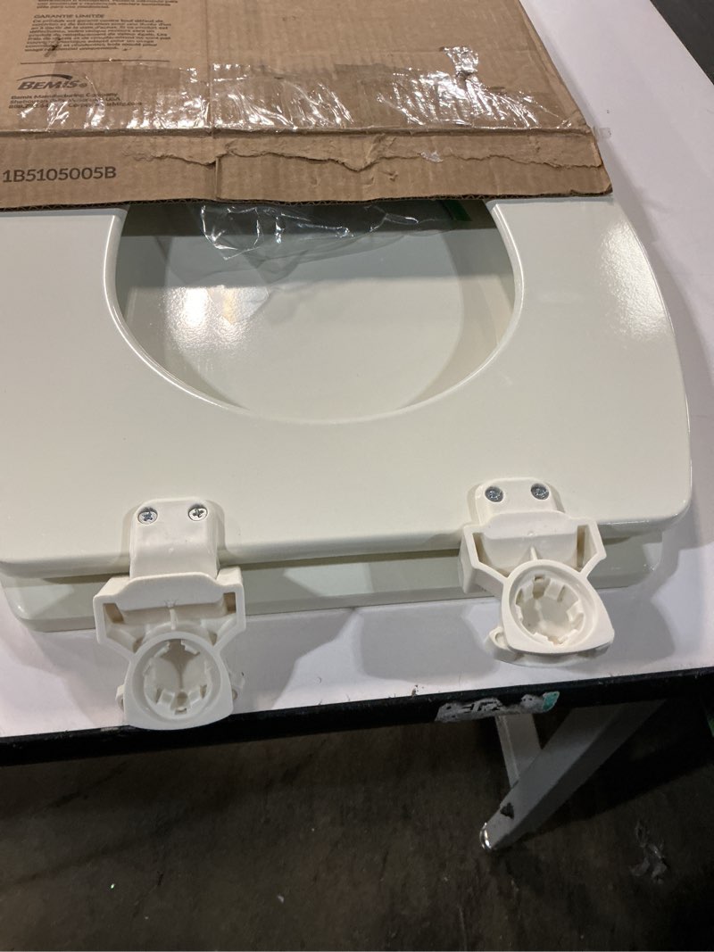 Condition photo showing Good Condition for Bemis Elongated Enameled Wood Toilet Seat in Biscuit with Easy•Clean? Hinge