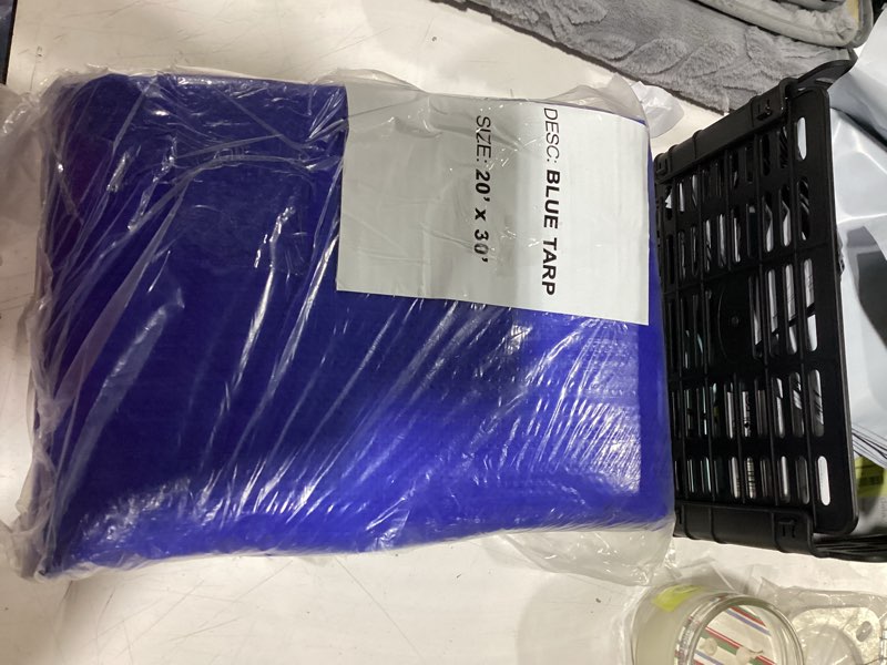 Condition photo showing New/Like New for 20 ft. x 30 ft. multi-purpose blue tarp