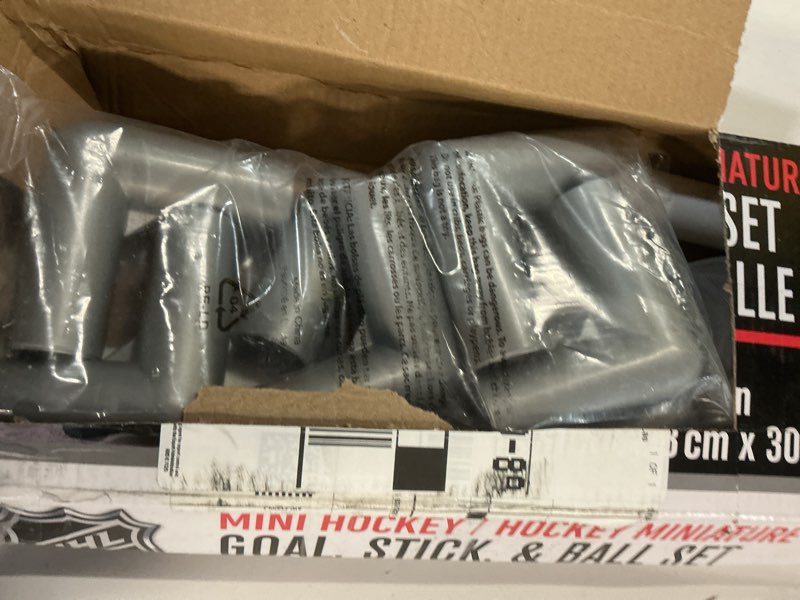 Condition photo showing As Is for franklin sports nhl kids mini hockey goal set - (2) mini + knee hockey goals, (4) youth sticks, (2) goalie sticks + (4) foam balls - knee + mini hockey set black one size