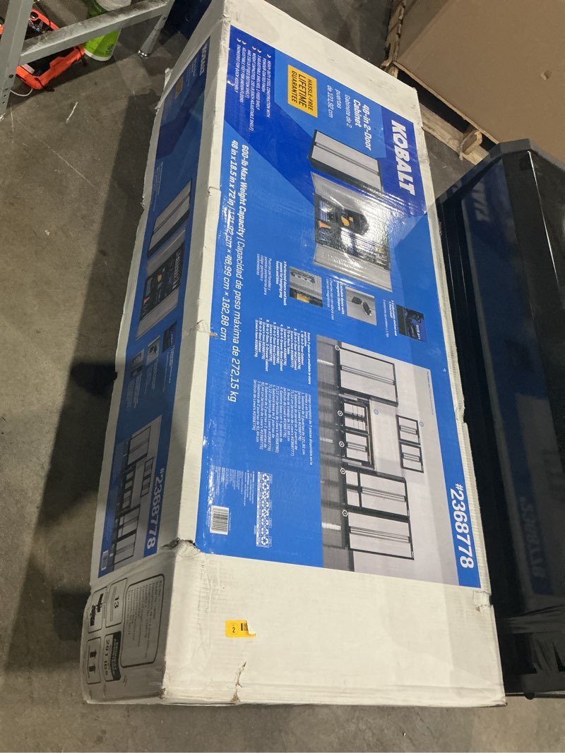 Condition photo showing As Is for kobalt 48-in w x 72-in h x 18.5-in d freestanding steel garage cabinet in silver