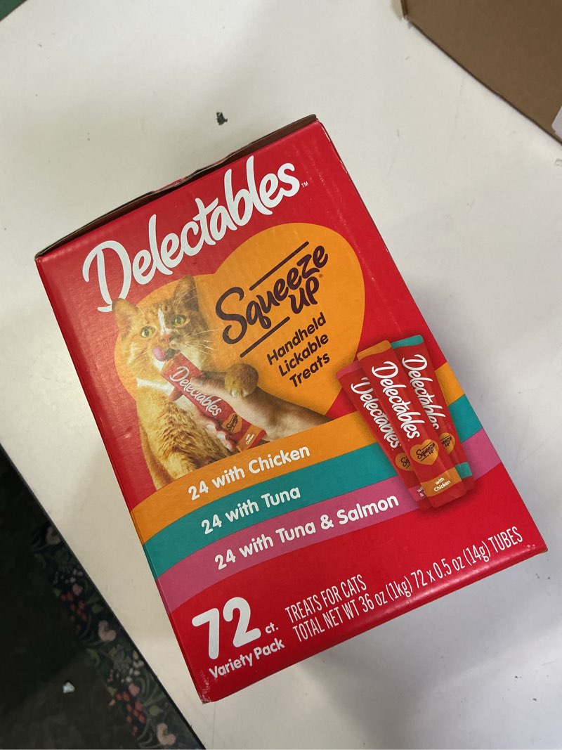 Condition photo showing New/Like New for ub 11-14-26 delectables squeeze up variety pack, creamy squeezable puree, lickable wet cat treats, grain free, no added fillers, no by-products, no added preservatives, 0.5 ounces tube, 72 tubes total