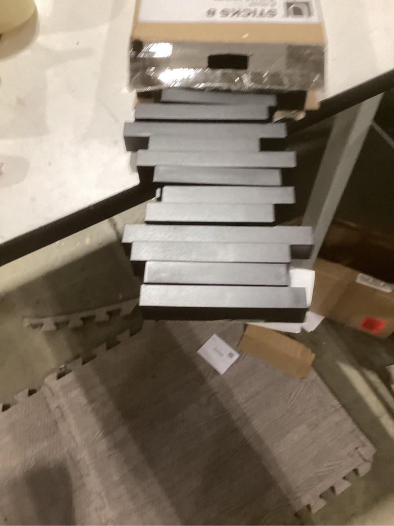 Condition photo showing As Is for Umbra Sticks Wall-Mounted Coat Rack Rail Hook with 5 Retractable Pegs – Modern, Space-Saving Storage Organizer, Black Black 5-Hook