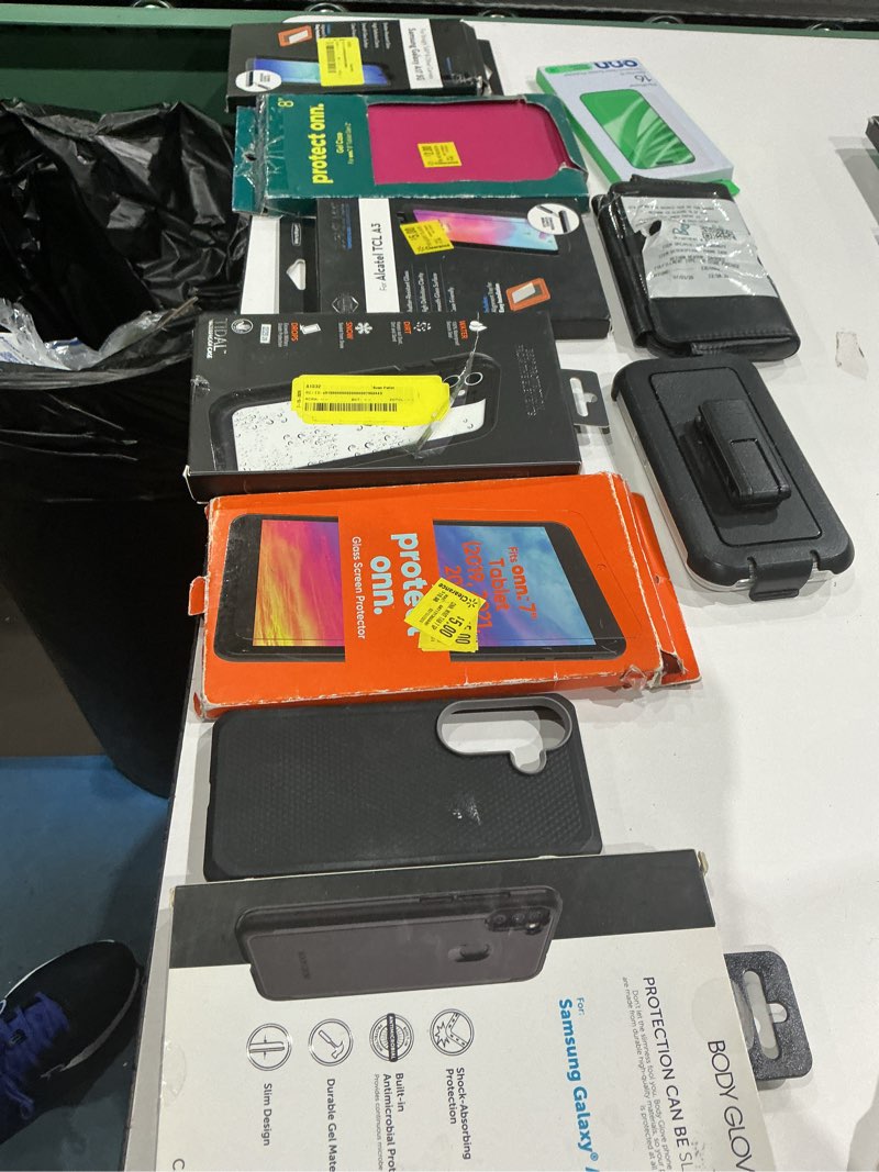 Condition photo showing As Is for assorted cellphone/tablet/laptop case covers & accessories