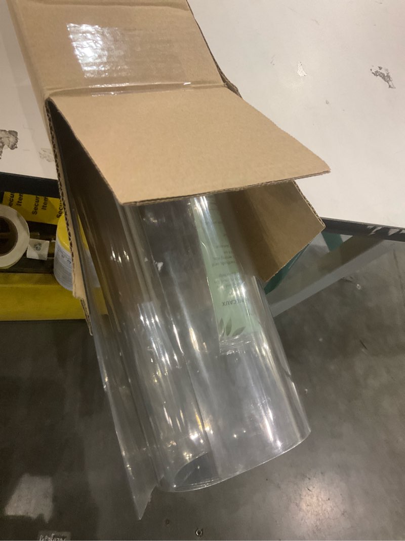 Condition photo showing As Is for NECAUX Custom 18 x 64 Inch Clear Table Cover Protector, 1.5mm Thick Plastic Waterproof Heavy Duty Table Pad Desk Mat Desk Protector for Computer Writing Desk, Console Table, Media Stand, Countertop 18" x 64" Clear 1.5mm