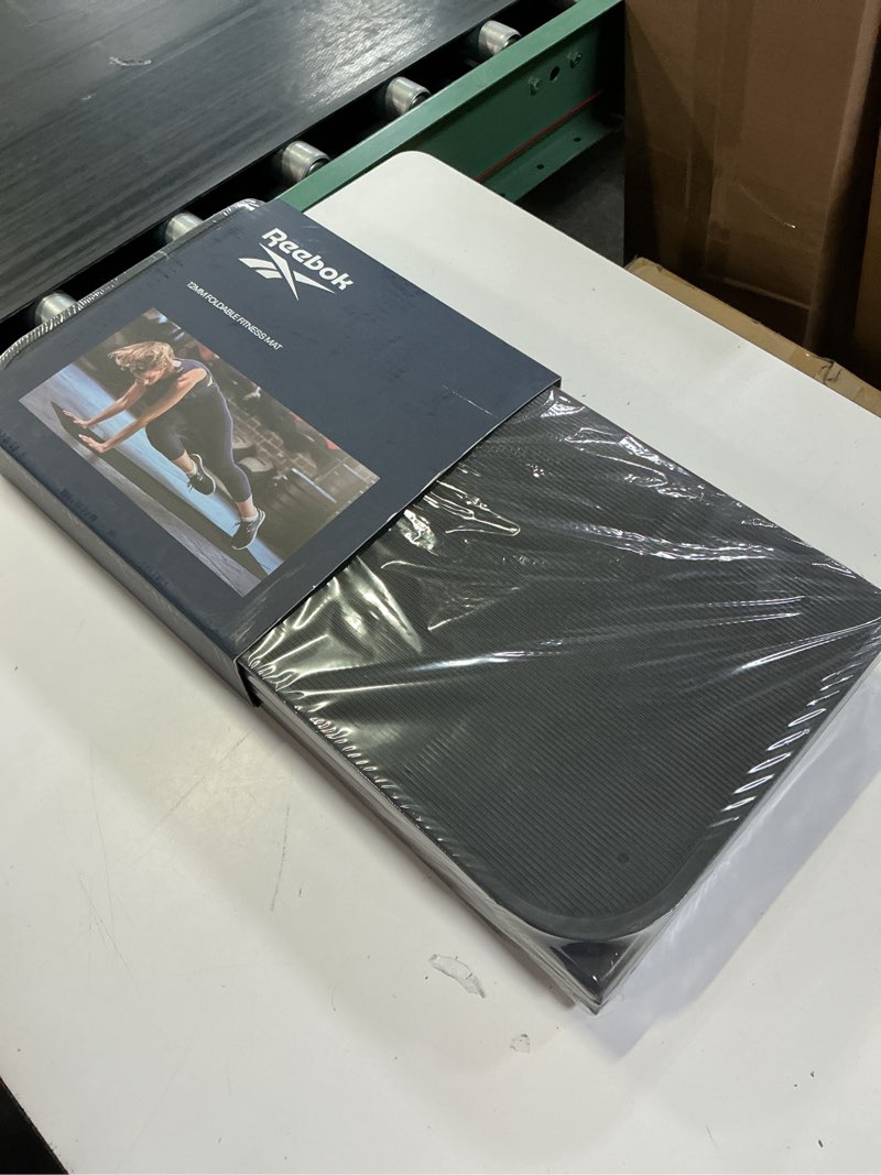 Condition photo showing New/Like New for reebok foldable fitness mat (12 mm)