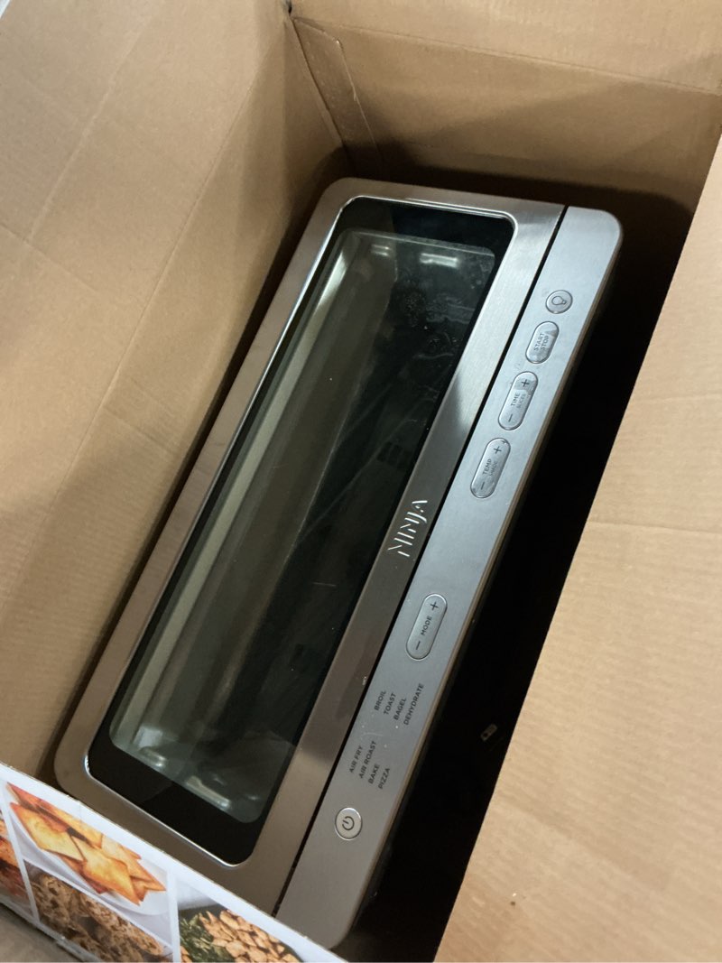 Condition photo showing As Is for Ninja Air Fryer Toaster Oven Combo | 8-in-1 Functionality | Flip Up & Away for Storage Space | Air Fry Basket, Sheet Pan, Wire Rack & Removable Crumb Tray |1800 Watt | Stainless Steel | SP151 Stainless Premium 8-in-1 Flip Oven