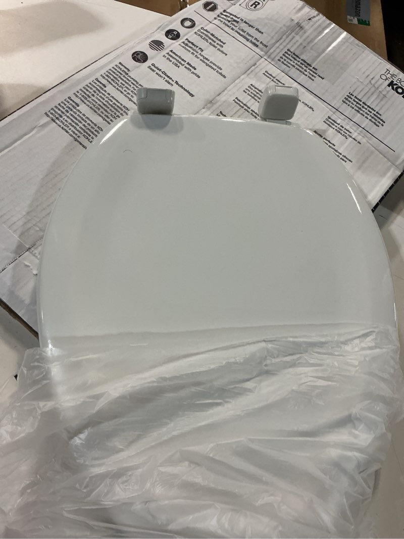 Condition photo showing As Is for kohler stonewood quiet-close, elongated toilet seat soft close, durable wood, easy installation, universal fit, home essentials, white finish, k-20466-0 white elongated double-hinge