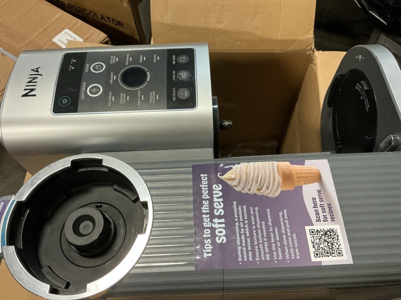 Condition photo showing As Is for ninja creami scoop & swirl ice cream maker, soft serve desserts, sorbet, milkshakes, frozen yogurt and more, 13-in-1 programs, includes handle and two 16 oz 2-in-1 pints, nc701 creami swirl ice cream maker