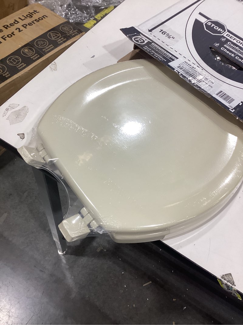 Condition photo showing Good Condition for KOHLER 4648-47 Stonewood Round Toilet Seat, Wood Seat for Standard Round Toilets, Lid with Color-Matched Plastic Hinges, Almond Almond Round