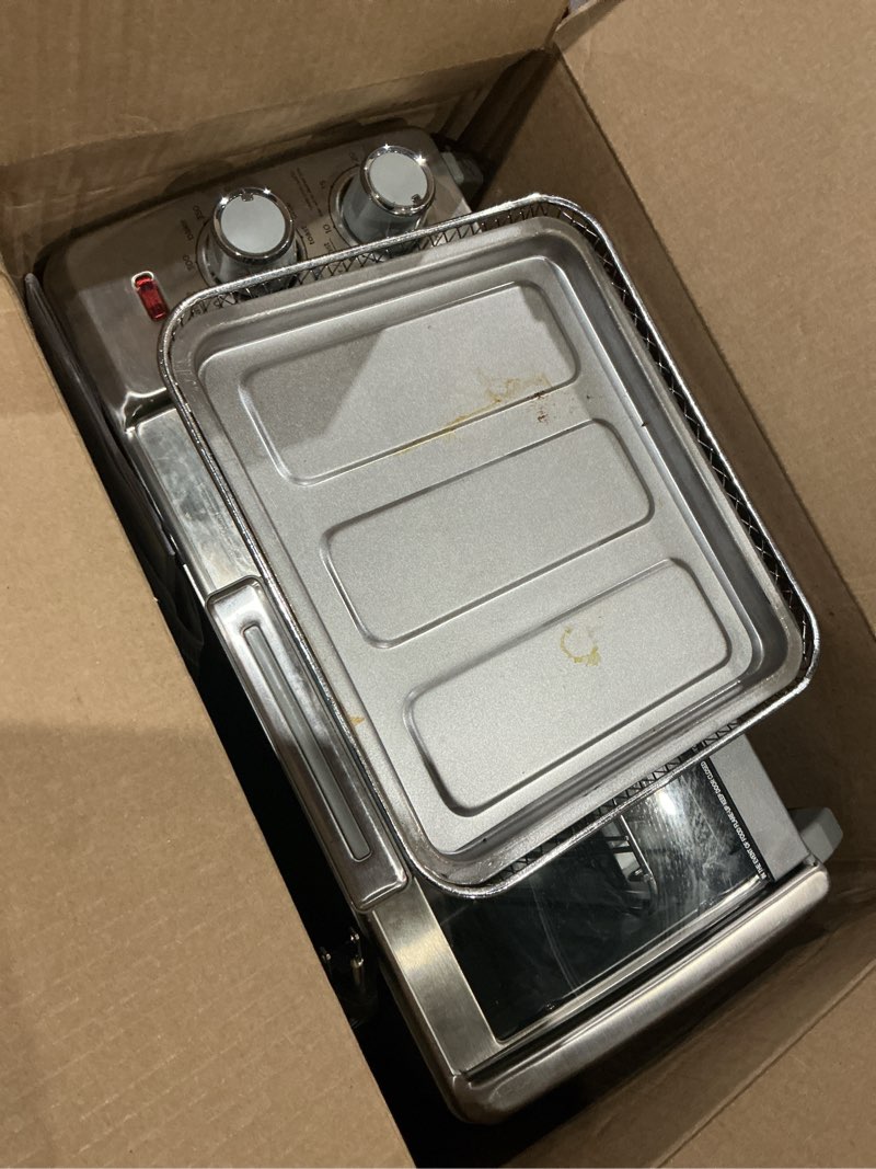 Condition photo showing As Is for black+decker crisp 'n bake air fry countertop convection toaster oven, medium capacity, 4-slice, 5-in-1, fits 9” pizza, 30-min timer, bake, broil, air fry, toast, keep warm, stainless steel