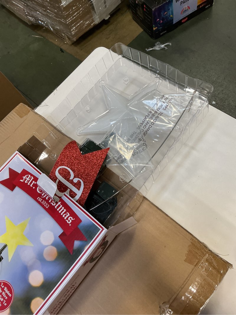 Condition photo showing New/Like New for Mr. Christmas Animated White Santa's Bi-Plane Christmas Tree Topper with Banner, Illuminated LED Star, Velcro Straps to Easily Attach, 21.75 Inches White Santa in Plane