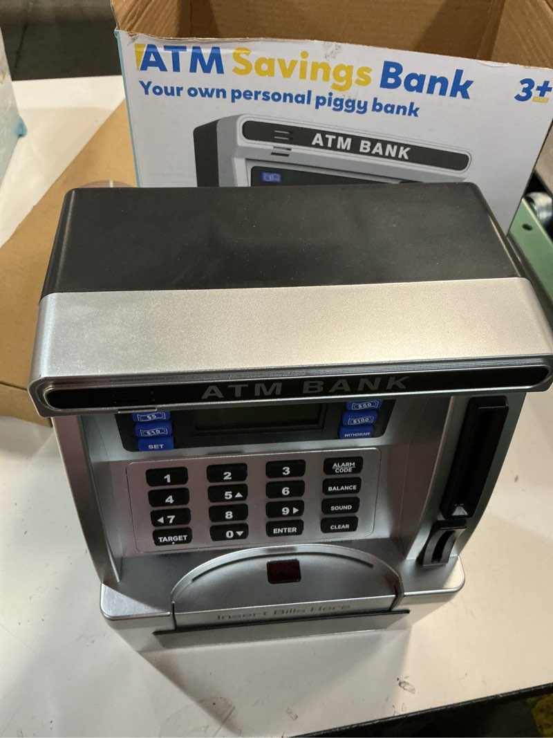Condition photo showing As Is for atm piggy bank for kids, atm machine for real money with debit card, bill feeder, coin recognition, balance calculator, electronic savings safe box, gifts for teen boys girls black
