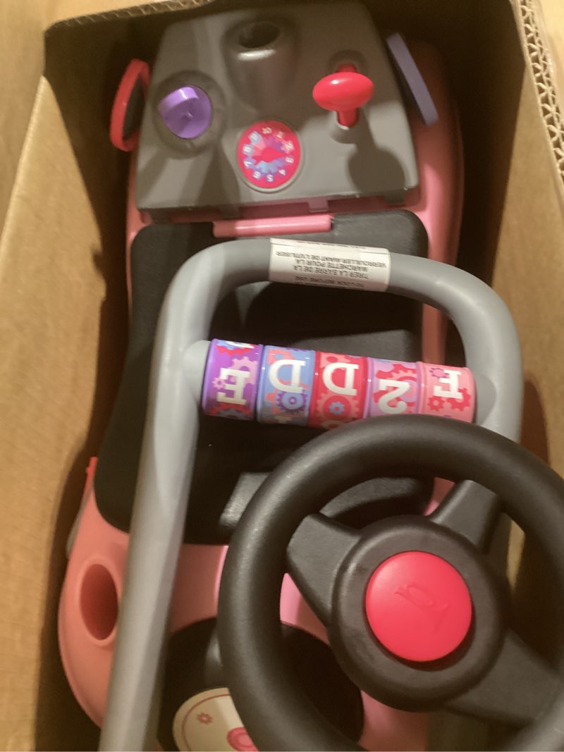 Condition photo showing Good Condition for Radio Flyer Creativity Car, for Toddlers 1-3, 3-in-1 Push Walker Ride On Rocket with 17 Sensory Activities, Anti-Tip Feature, Under-Seat Storage, Horn and Gears, 42 lb Capacity, Toddler Ride On Toys Pink
