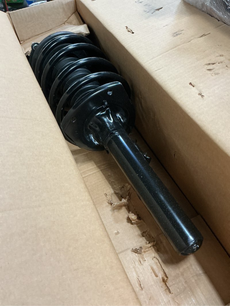 Condition photo showing As Is for monroe quick-strut 371616 suspension strut and coil spring assembly for ford taurus