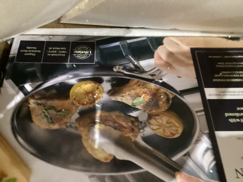 Condition photo showing New/Like New for Anolon Everlast N2 Carbon Steel Frying Pan/Skillet with Helper Handle, Compatible with All Cooktops, Metal Utensil Safe, 10 Inch Open Fry Pan - Black