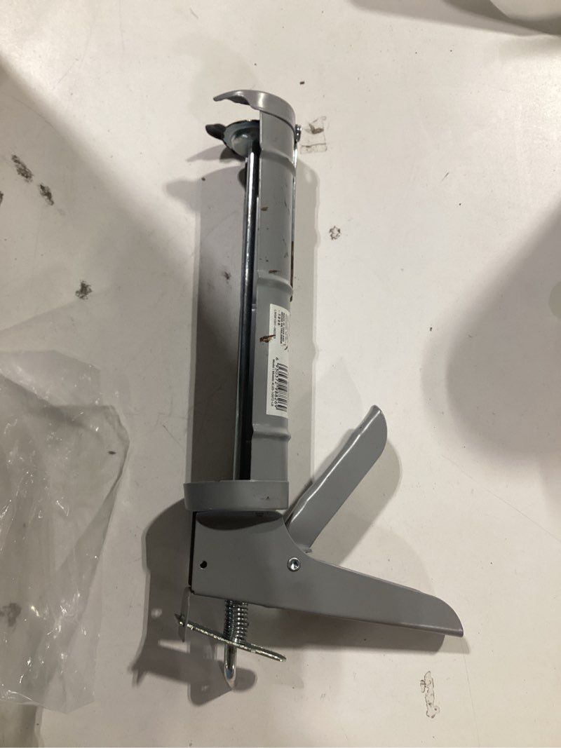 Condition photo showing As Is for project source 10 -oz smooth rod caulk gun