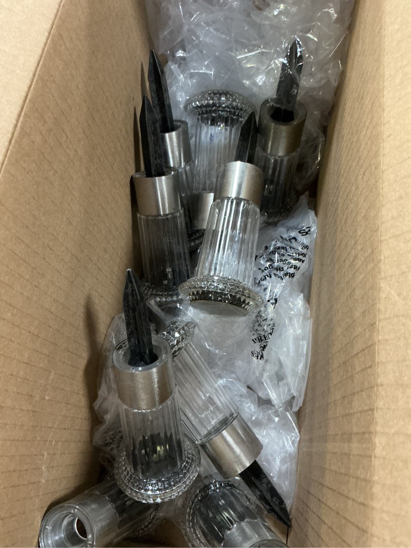 Condition photo showing As Is for denicmic solar lights outdoor 8 pack waterproof 6000k cold white led stainless steel stake outside lights for yard pathway garden driveway walkway landscape path lighting