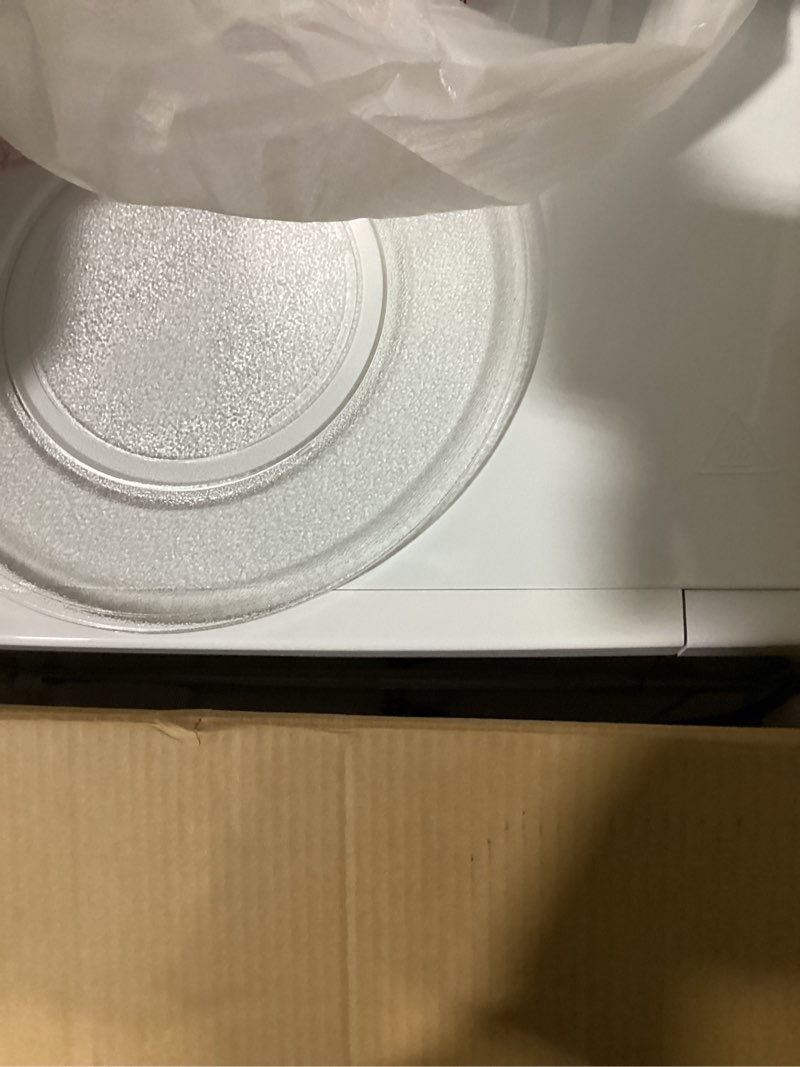 Condition photo showing As Is for ge countertop microwave oven,1, 200-watt capacity