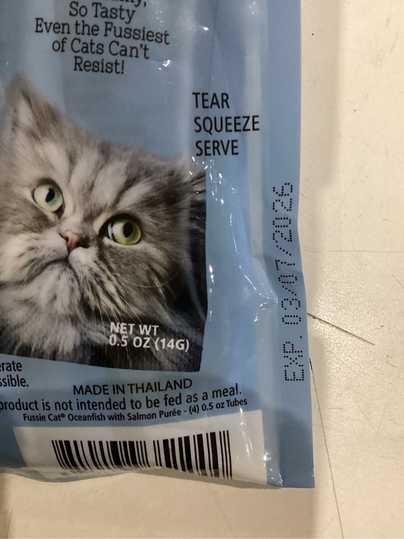 Condition photo showing Good Condition for Fussie Cat Ocean Fish and Salmon Puree, lickable cat Treats, 0.5oz, 4 count Pouch Pack of 1 Small