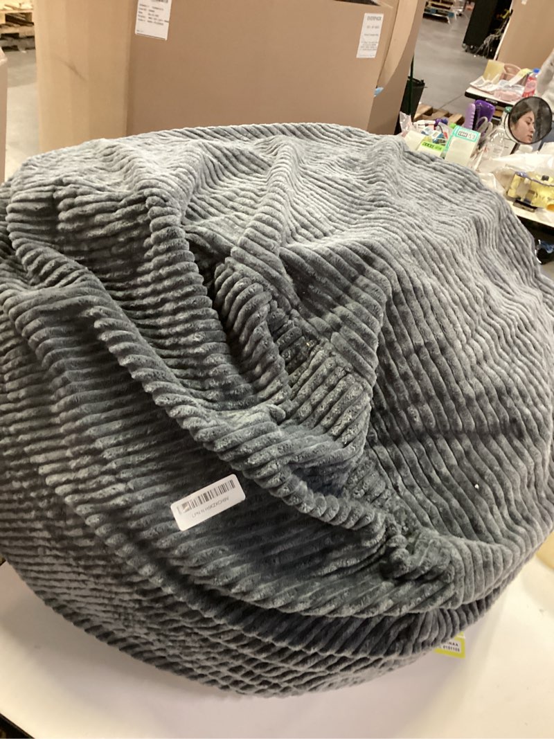 Condition photo showing As Is for AS AWESLING Round Ottoman Foot Rest Pouf for Living Room Couch - Soft Plush Hassock Dark Grey 26"D x 26"W x 18"H