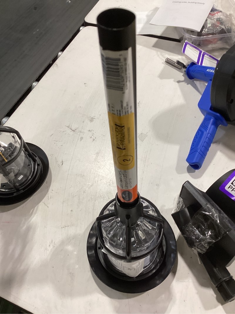 Condition photo showing As Is for harbor breeze path light 15 -lumens 0.2 -watt black solar led outdoor path light ( 3000-k ) incomplete