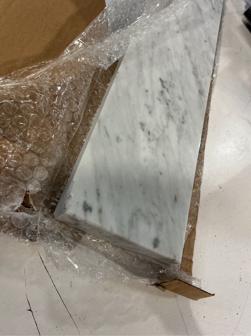 Condition photo showing As Is for allen + roth natural carrara marble 4-in h x 21-in l white natural marble bathroom side splash